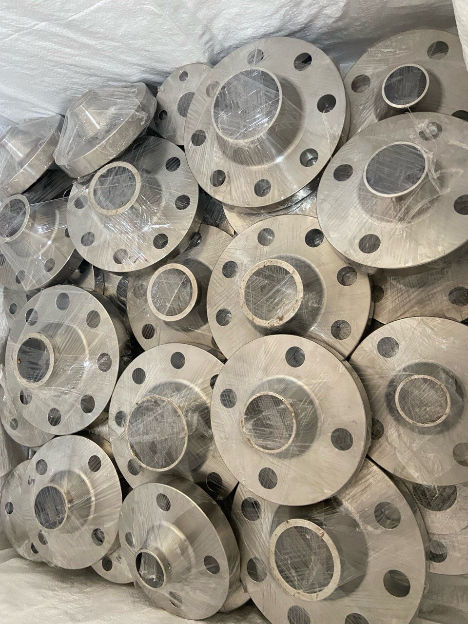 ASTM A182 F304 stainless steel weld neck flanges stretch-wrapped in ready stock at Tesco Steel & Engineering
