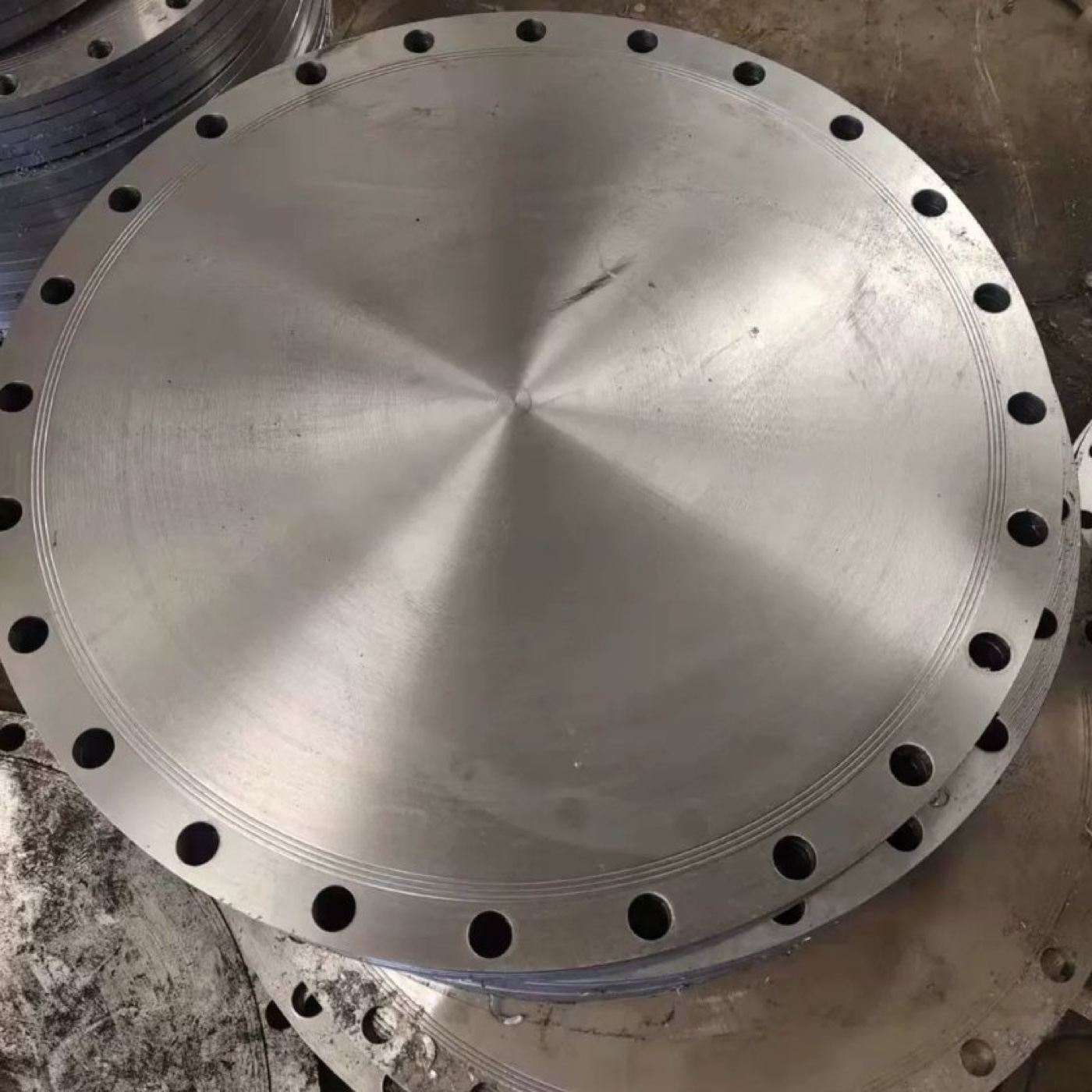 Large machined stainless steel blind flange for high temperature service at the works