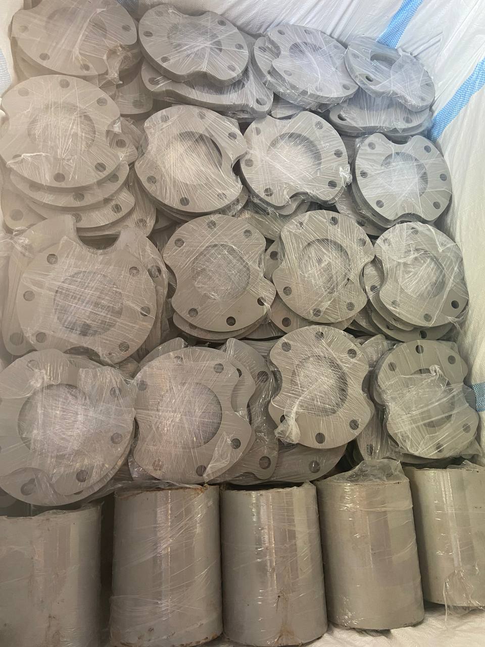 Mixed Monel 400 blind and weld neck flanges plastic-wrapped in export shipping container — ASTM B564 UNS N04400, Tesco Steel & Engineering India