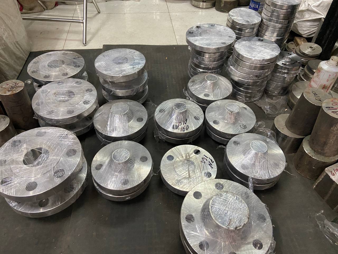 Monel 400 weld neck flanges in various sizes arranged on dispatch table before export packing — ASTM B564 UNS N04400, Tesco Steel & Engineering India