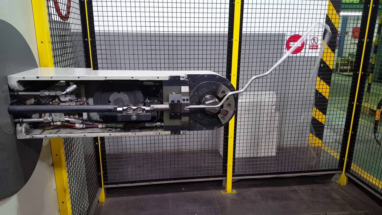 CNC wire bending machine forming a V type refractory anchor at Tesco Steel & Engineering