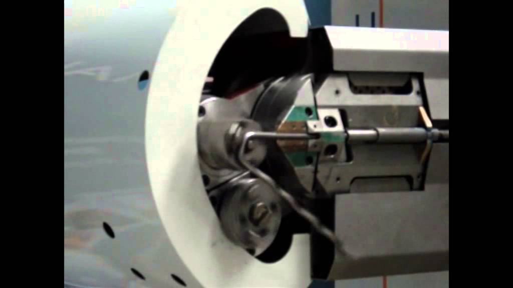 CNC wire forming head producing a Y type refractory anchor