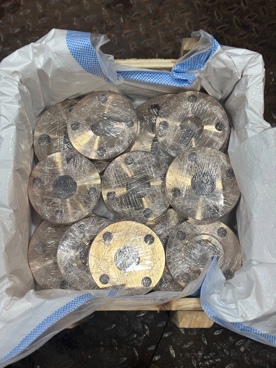 Copper nickel C70600 flanges individually wrapped and packed in a wooden export crate at Tesco Steel and Engineering