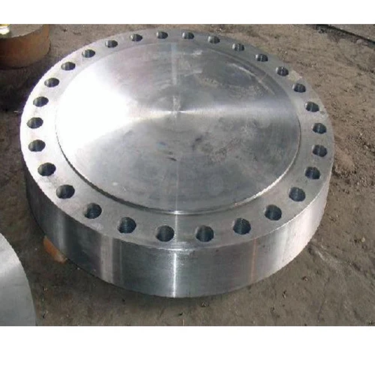 Heavy section forged blind flange with thick machined body on the works floor