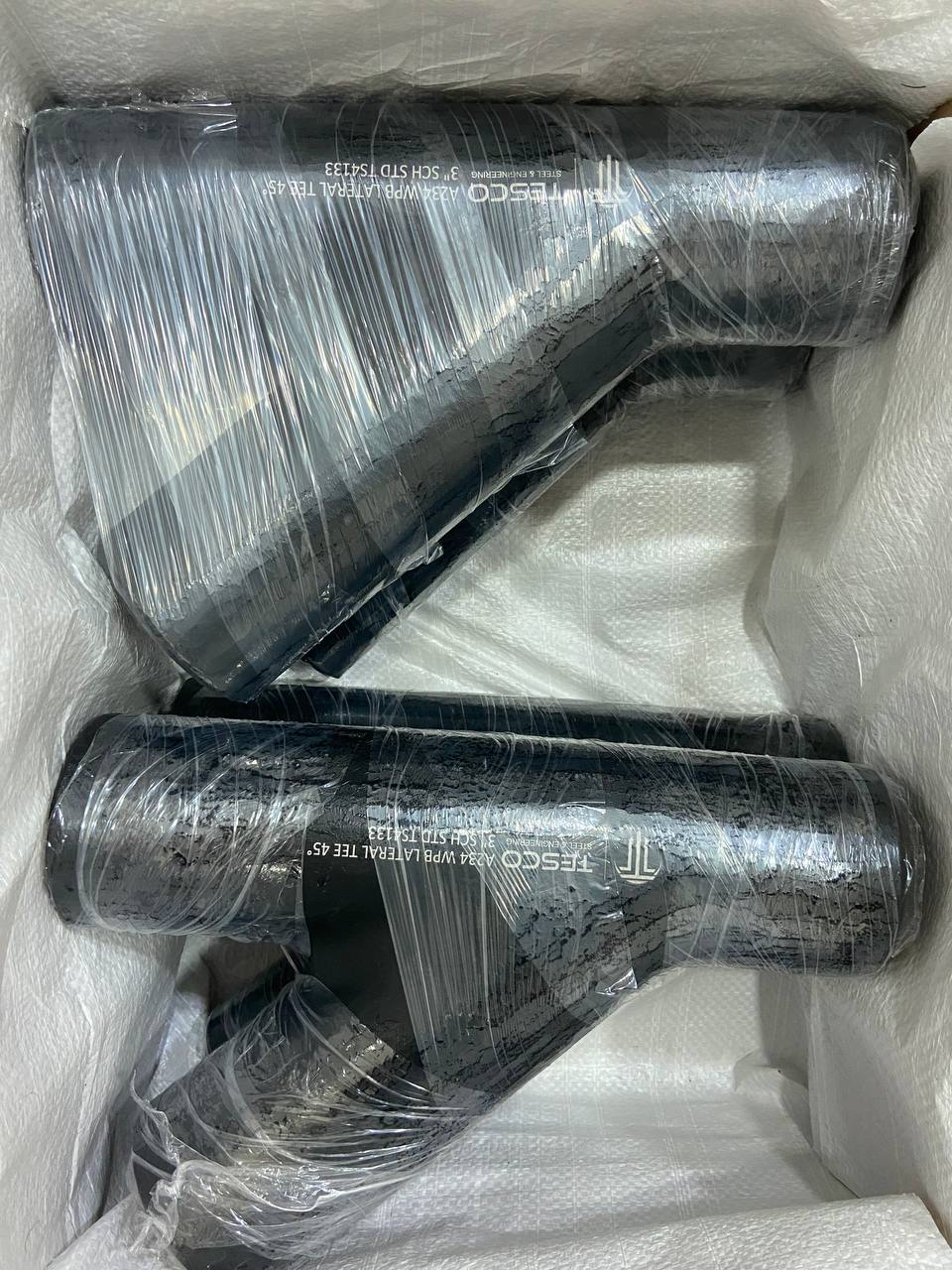 Carbon steel A234 WPB 45 degree lateral tees in export packing box