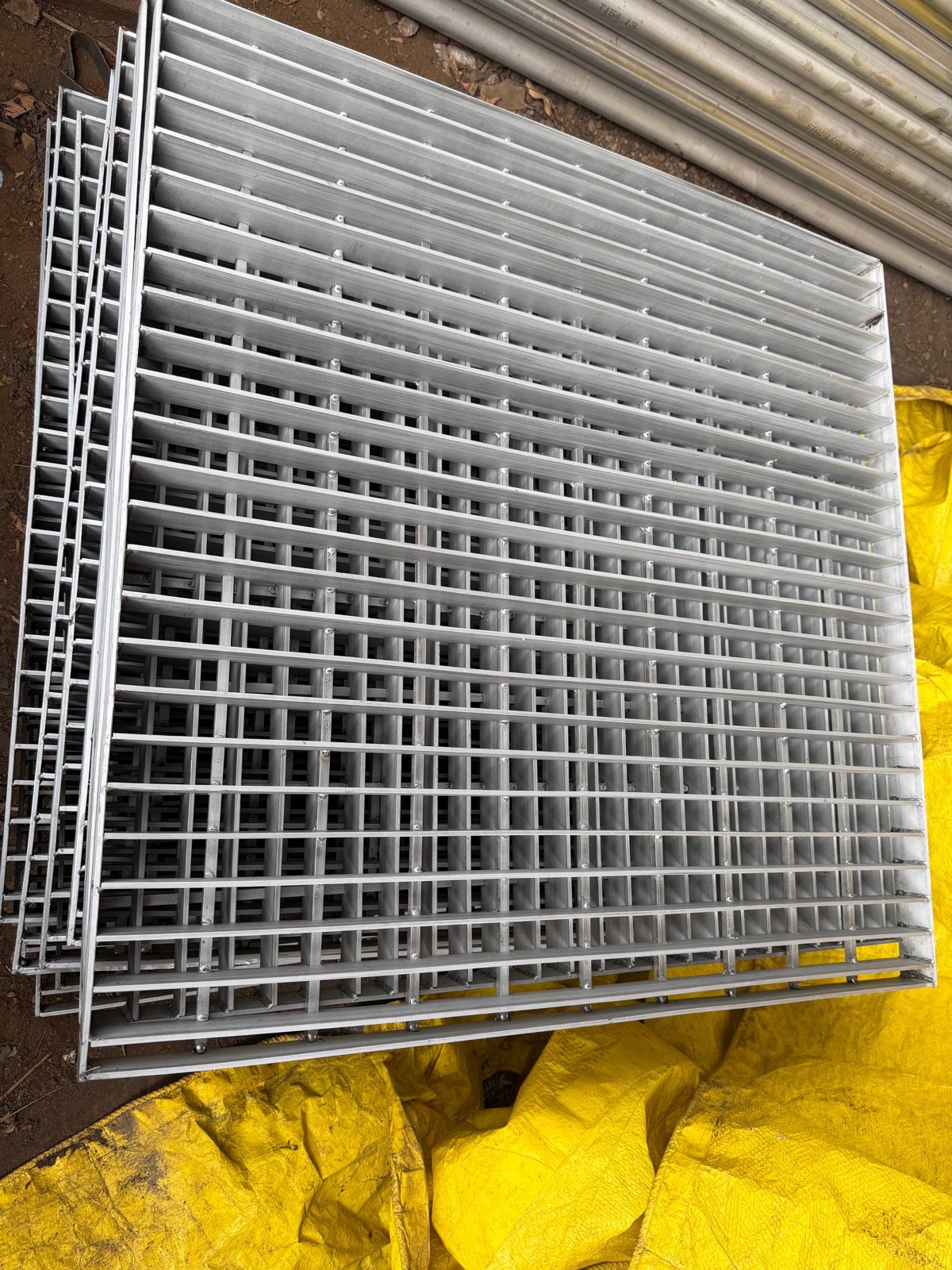 Steel grating panels showing bearing bar and cross bar grid