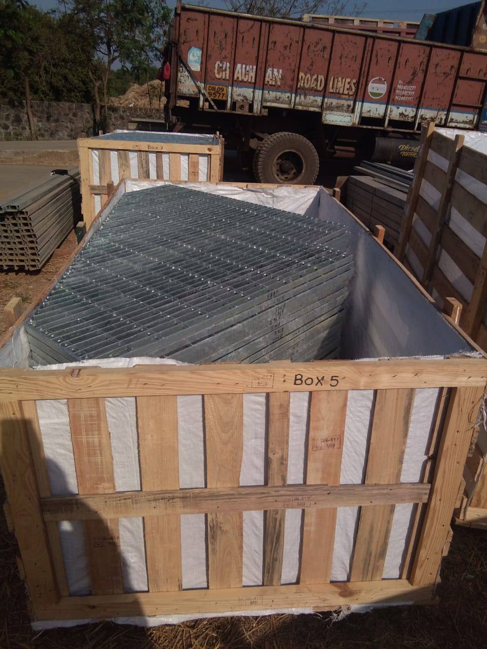 Galvanized steel grating panels packed in a crate for export