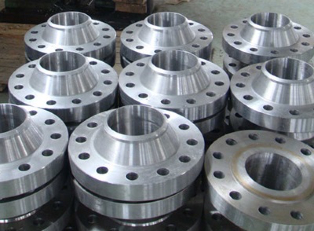 Titanium Grade 5 Ti-6Al-4V weld neck flanges machined and stacked in production — Tesco Steel & Engineering